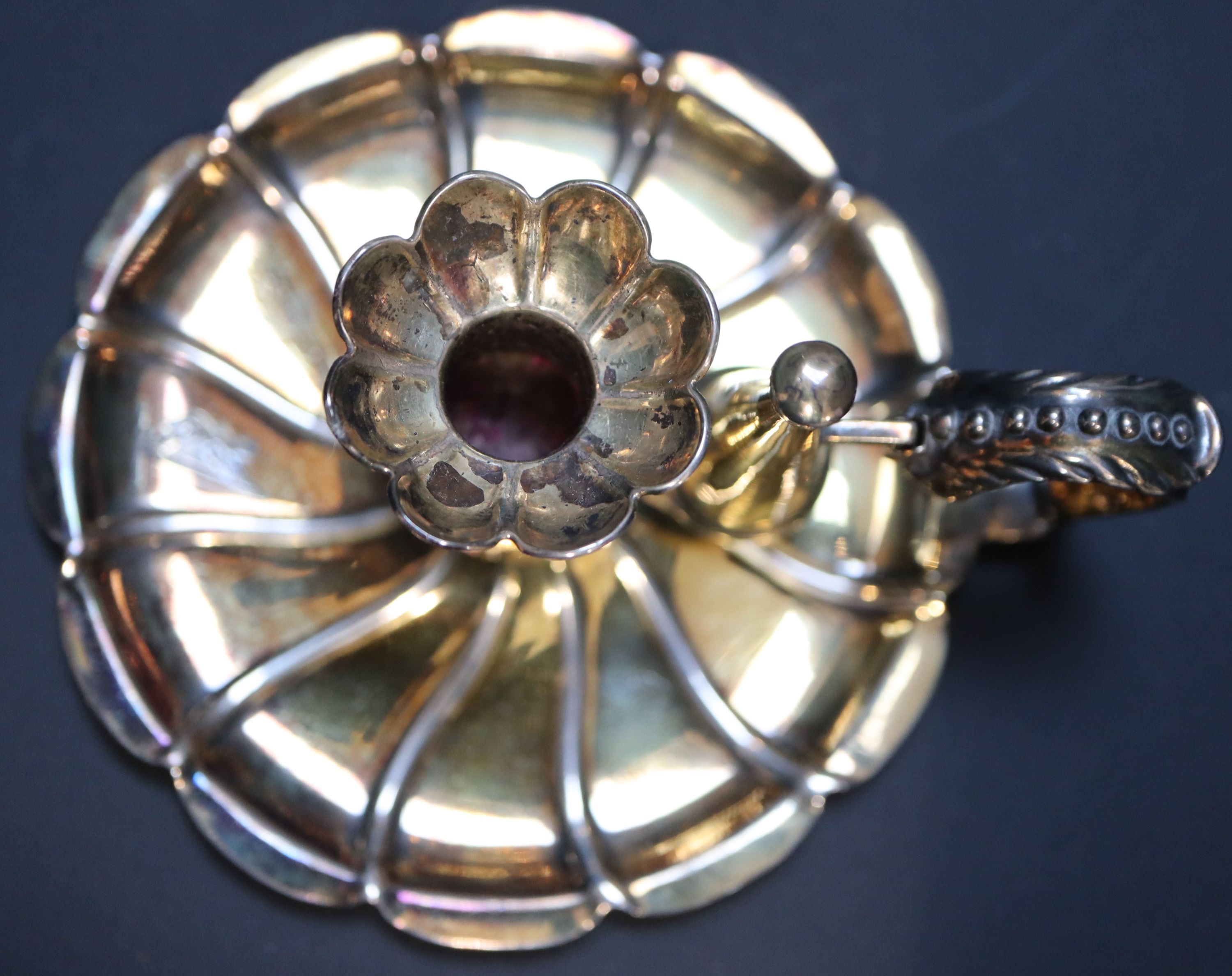 A Victorian silver gilt miniature chamberstick, height 6.5cm, 4oz.